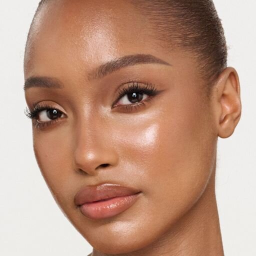 UNREAL SKIN SHEER GLOW TINT HYDRATERENDE FOUNDATIONSTICK 10 TAN